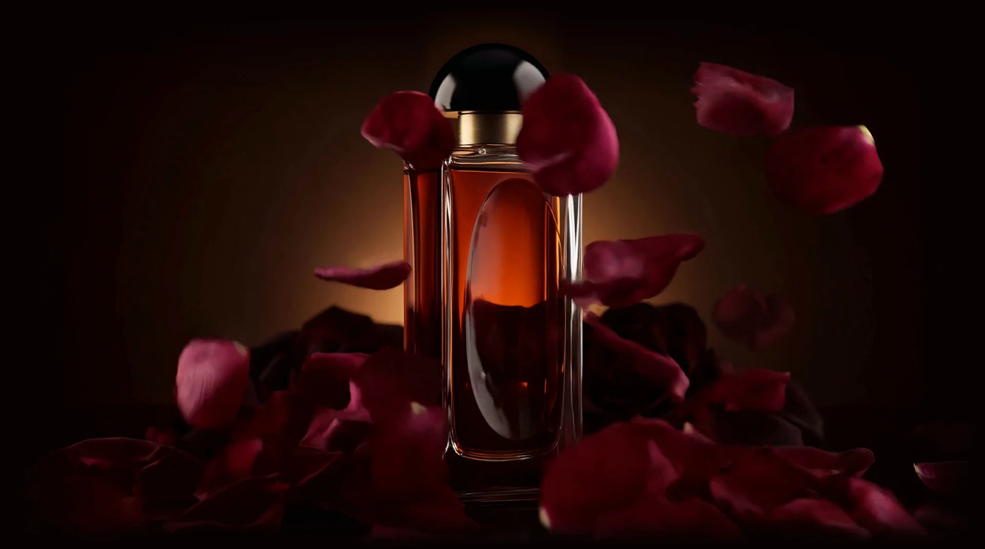 A storm of dark rose petals swirls around the NOCTAIRE bottle in warm light. As you scroll, the petals lift away and the bottle is revealed.